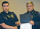 Ferris Police Chief Eddie Salazar presents Ferris Police Officer Christian Cortez with Life-Saving Award during the Monday, May 6 Ferris City Council meeting.