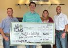 AgTexas Branch Manager Matt Thomas presents Brayden DeBorde, Ellis County 4H, with a $1,000 scholarship check.