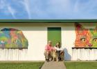 Instead of boring exterior walls to welcome new pet owners inside, Waxahachie Chief of Police, Wade Goolsby and Animal Services Manager, Cathy Le have graced the exterior with murals of a cat and a dog.