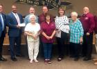 Ginger Kelley, Victron Energy assistant vice president, presented the grant checks to the district at the June 18 school board meeting.