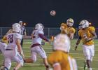 QB Jayden Saxon (4) completes pass over the middle to Kort Holley (10). Photo by Kirk Holt.
